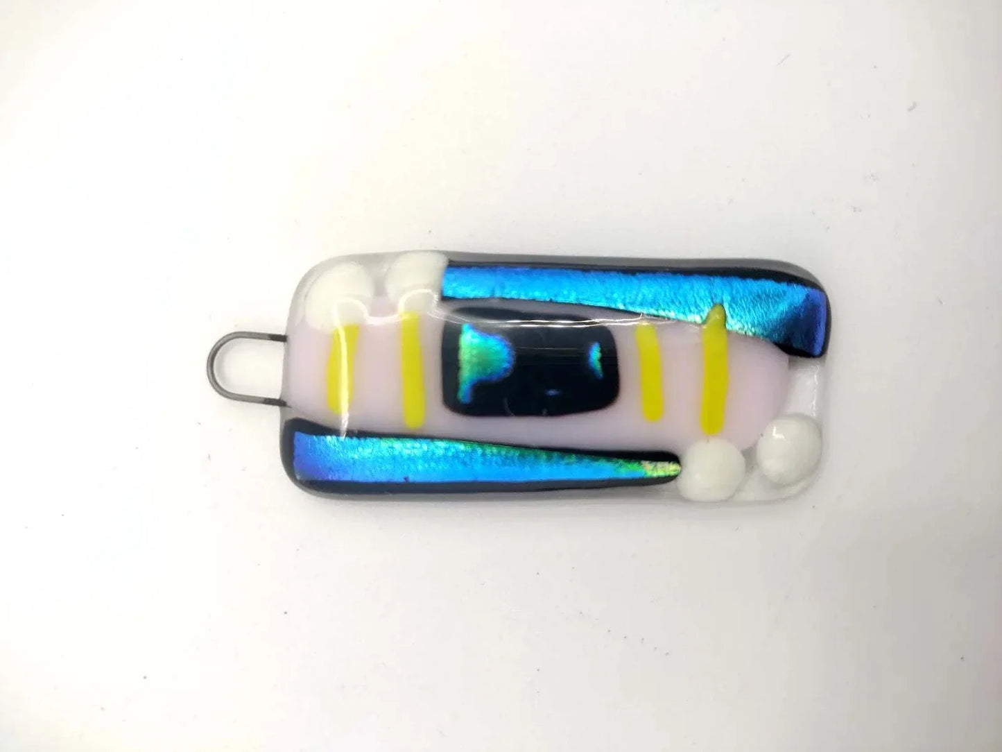 Fused glass pendant with iridescent blue, yellow, and white abstract design from Choose Your Own Fusing Project class