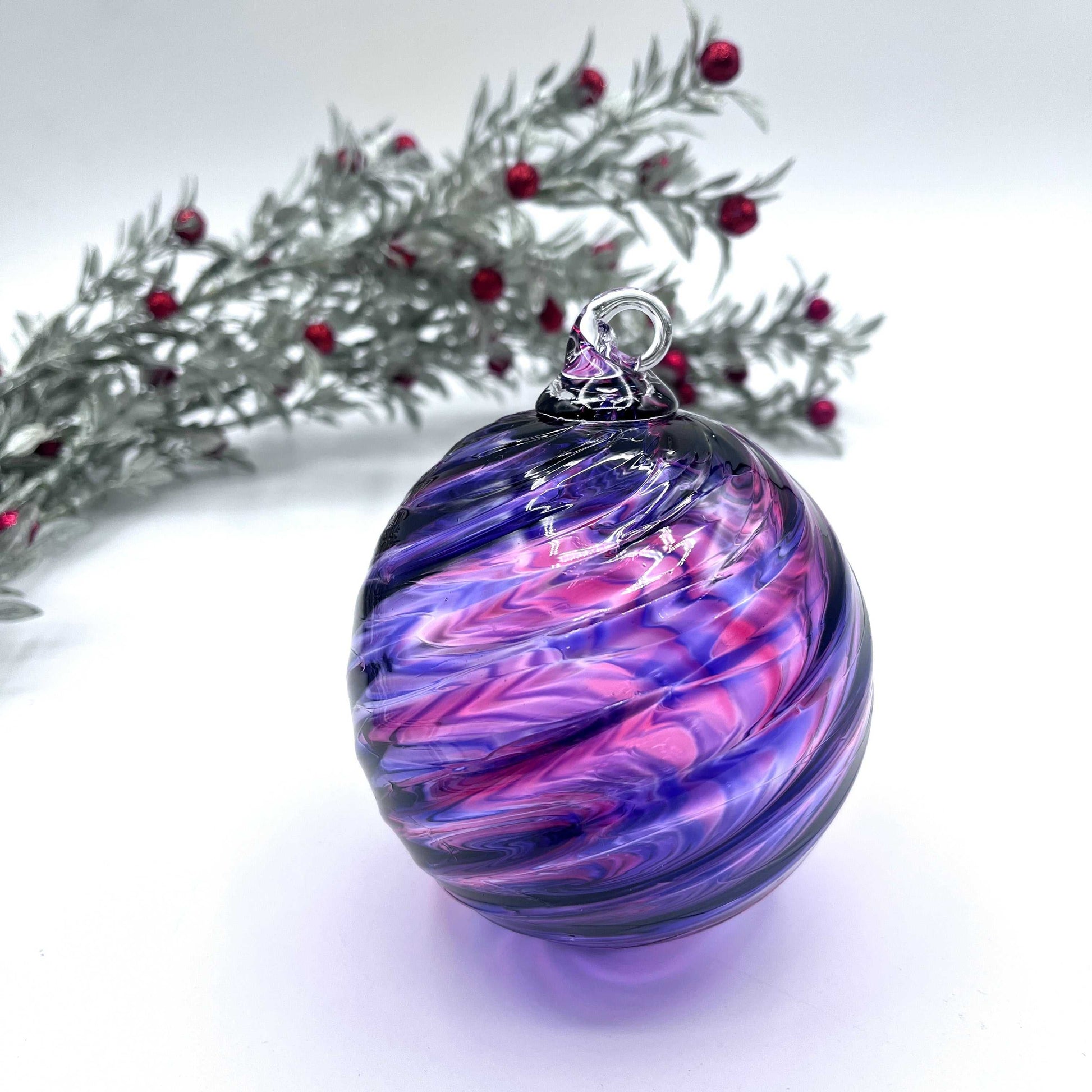 Purple Mix Spiral Twist hand blown glass ornament with swirling purple and pink hues, 4x4 inches, perfect for holiday gifts in a Kraft box