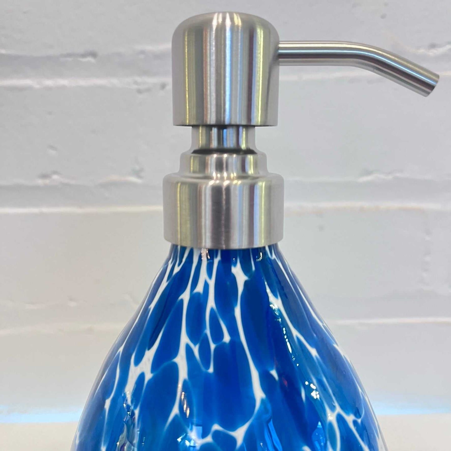Bluestone Soap Dispenser with stainless steel pump and blue patterned stone body for bathroom decor