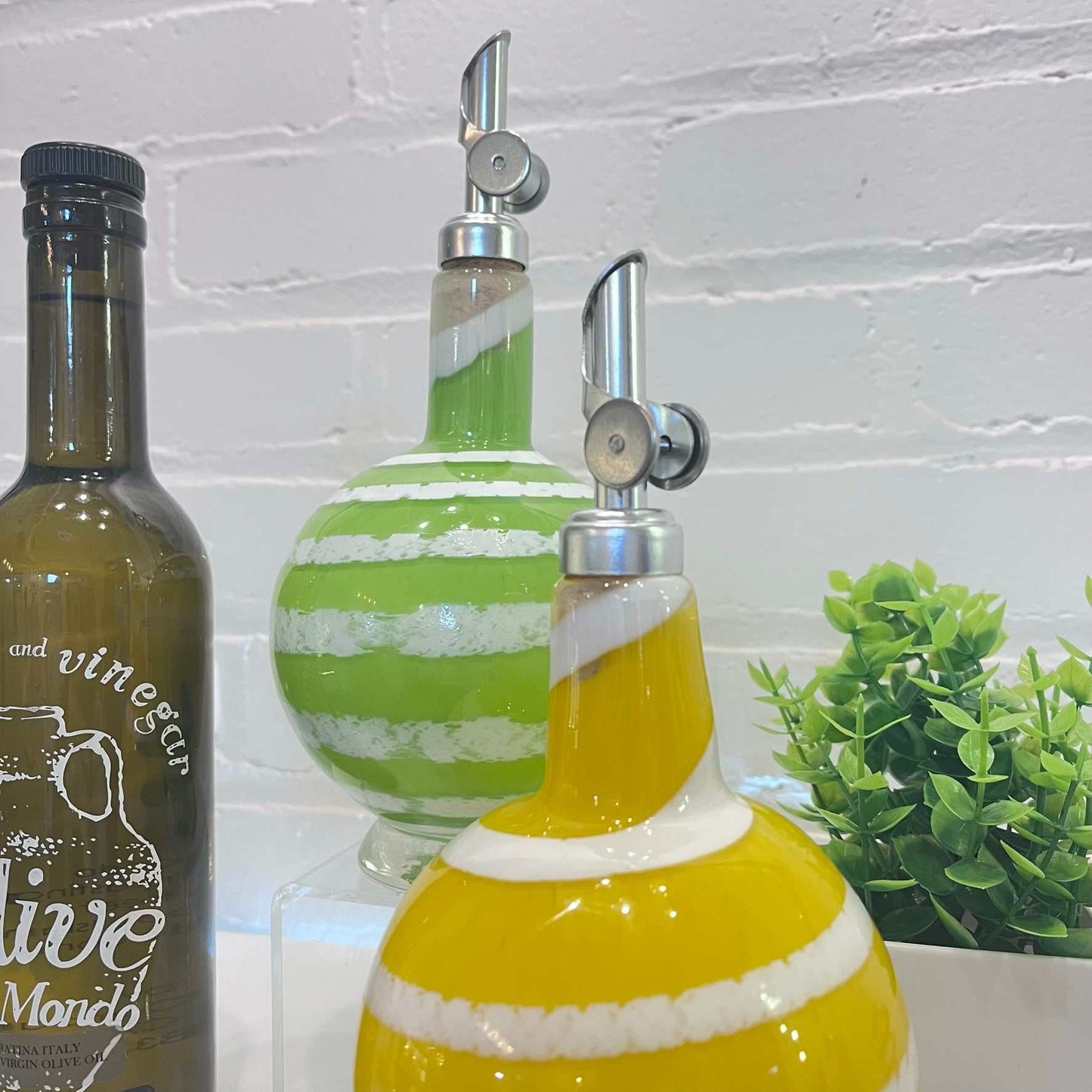 Set of 2 stylish oil and vinegar drizzler bottles with ergonomic pour spouts and colorful swirl design for kitchen use