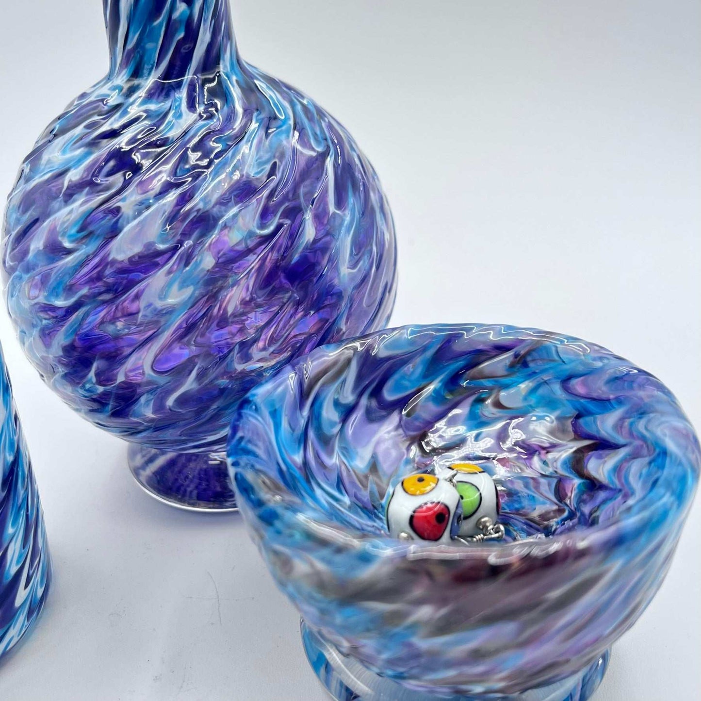 Marbled glass vanity set in hyacinth and aqua with handcrafted soap dispenser, bowl, and glass.