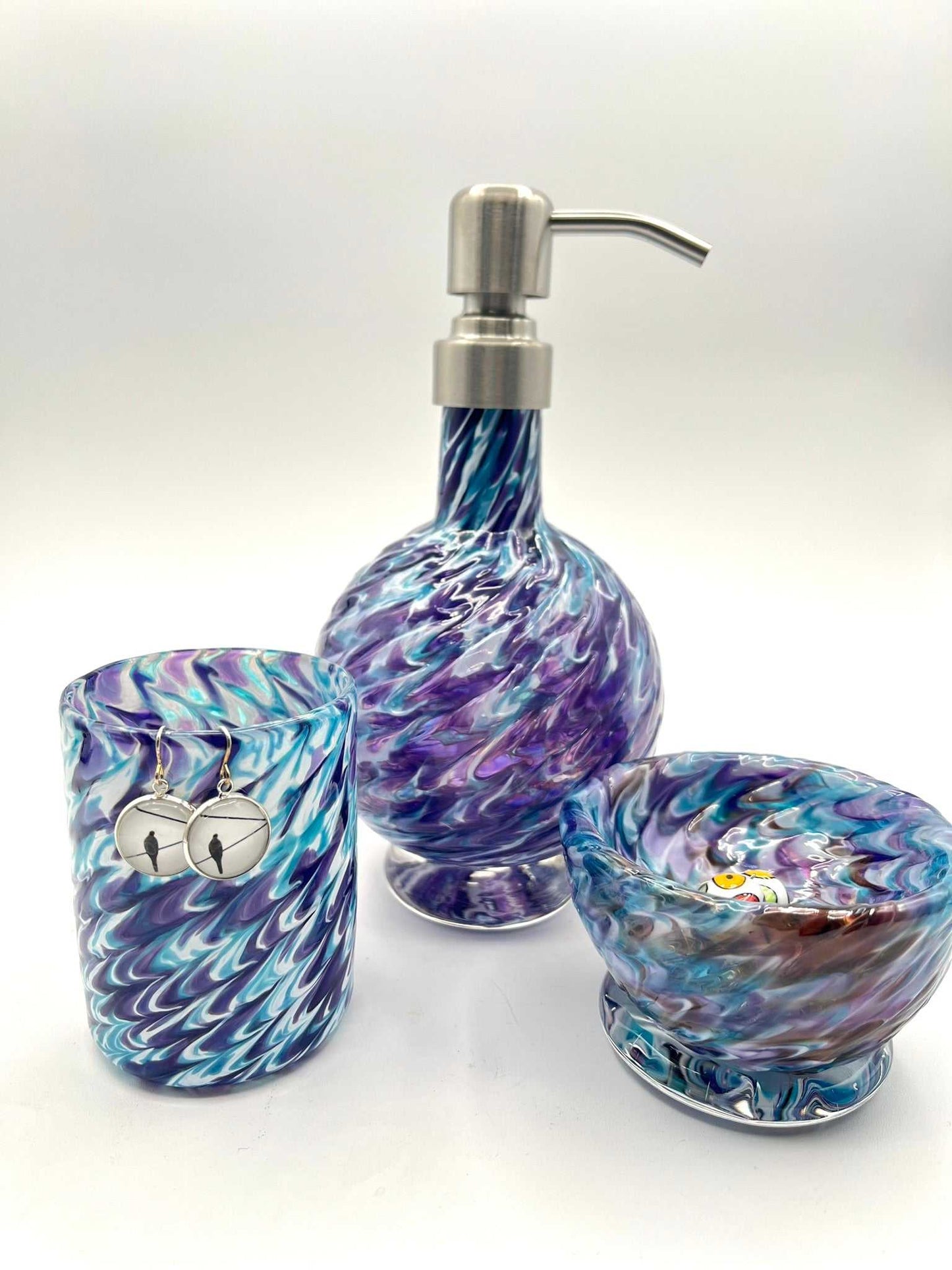 Marbled glass vanity set in hyacinth and aqua with soap dispenser, matching bowl, and coordinating glass handcrafted by artist