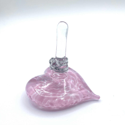 Rose pink hand-blown glass heart ring stand with elegant swirl design and clear upright holder for organizing jewelry