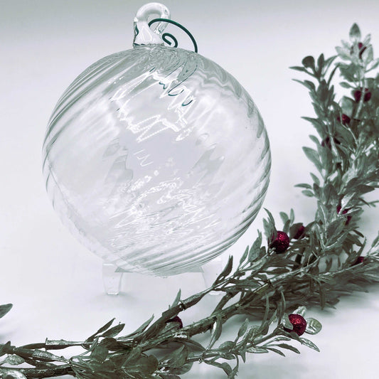 Clear blown glass ornament with spiral twist design, handcrafted and 4x4 inches in size