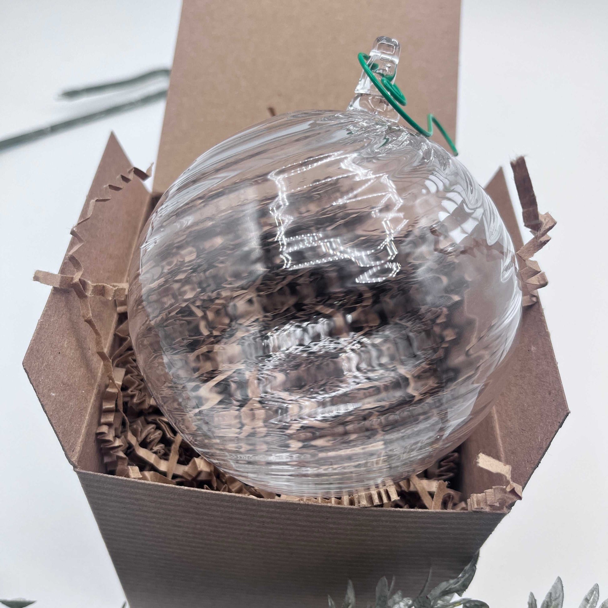 Hand blown clear glass ornament with spiral twist design in a gift box