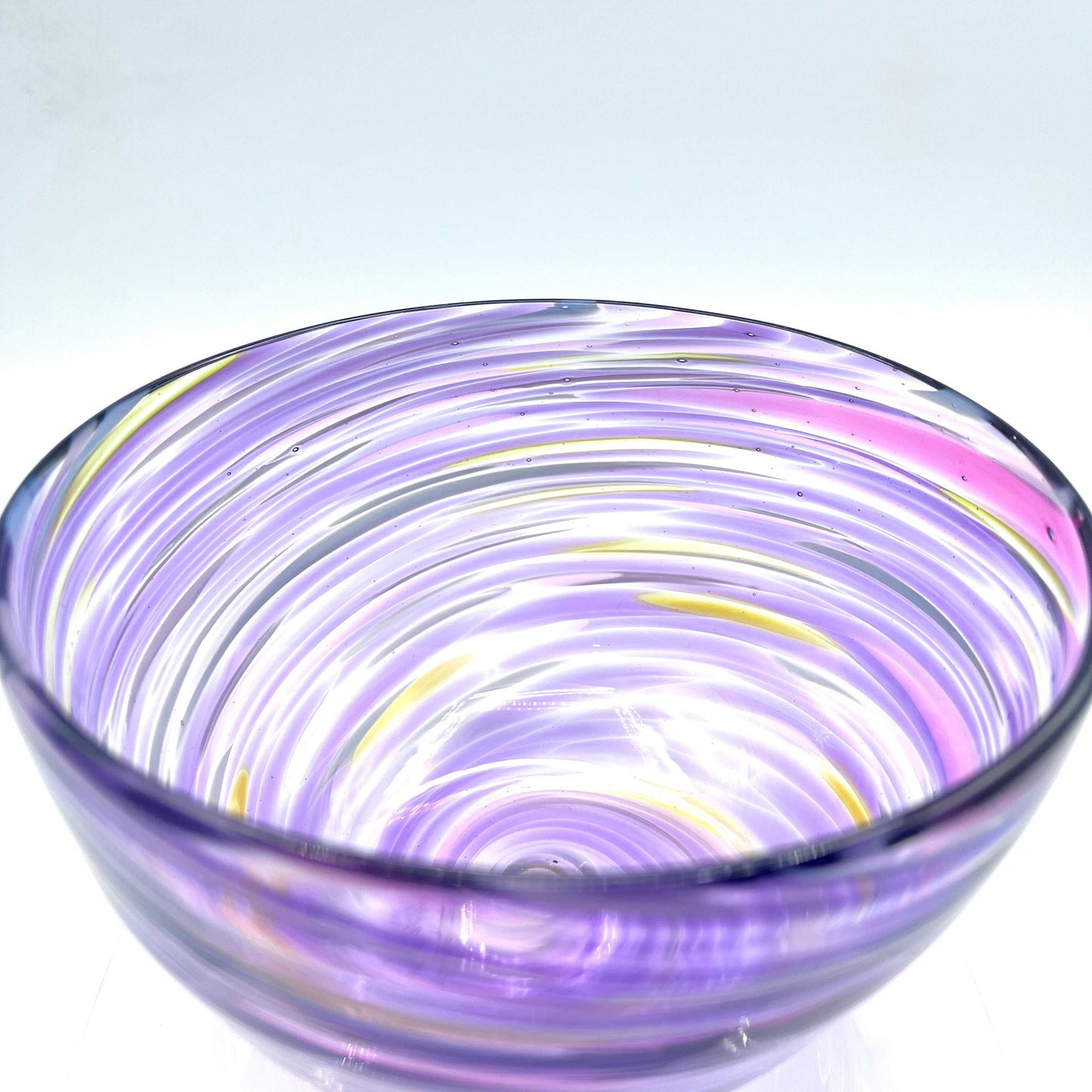 Hand-blown Fuschia Twist Glass Bowl with vibrant purple and yellow swirl design, 6x3 inches.
