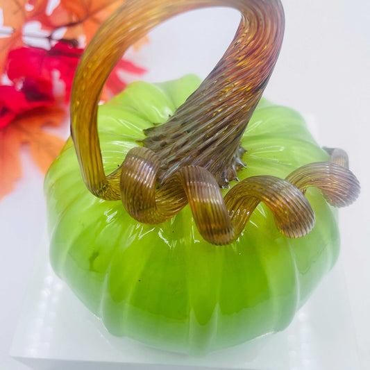 Hand-blown art glass pumpkin in granny green with gold stem, medium size, decorative autumn piece