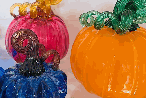 Colorful hand-blown glass pumpkins with curly stems for Make Your Own Pumpkin class