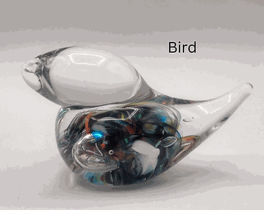 Handmade glass bird sculpture with colorful accents from Make Your Own Glass Bird class