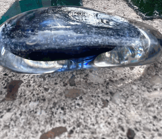 Glass Ash Memorial Healing Stone with unique colors and smooth design for pet remembrance.