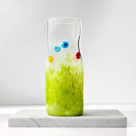 Hand blown flower art glass vase with green base and colorful glass flowers, signed and dated, 3 by 8 inches tall.