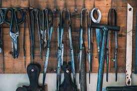 Full set of bench tools hanging on a wooden board