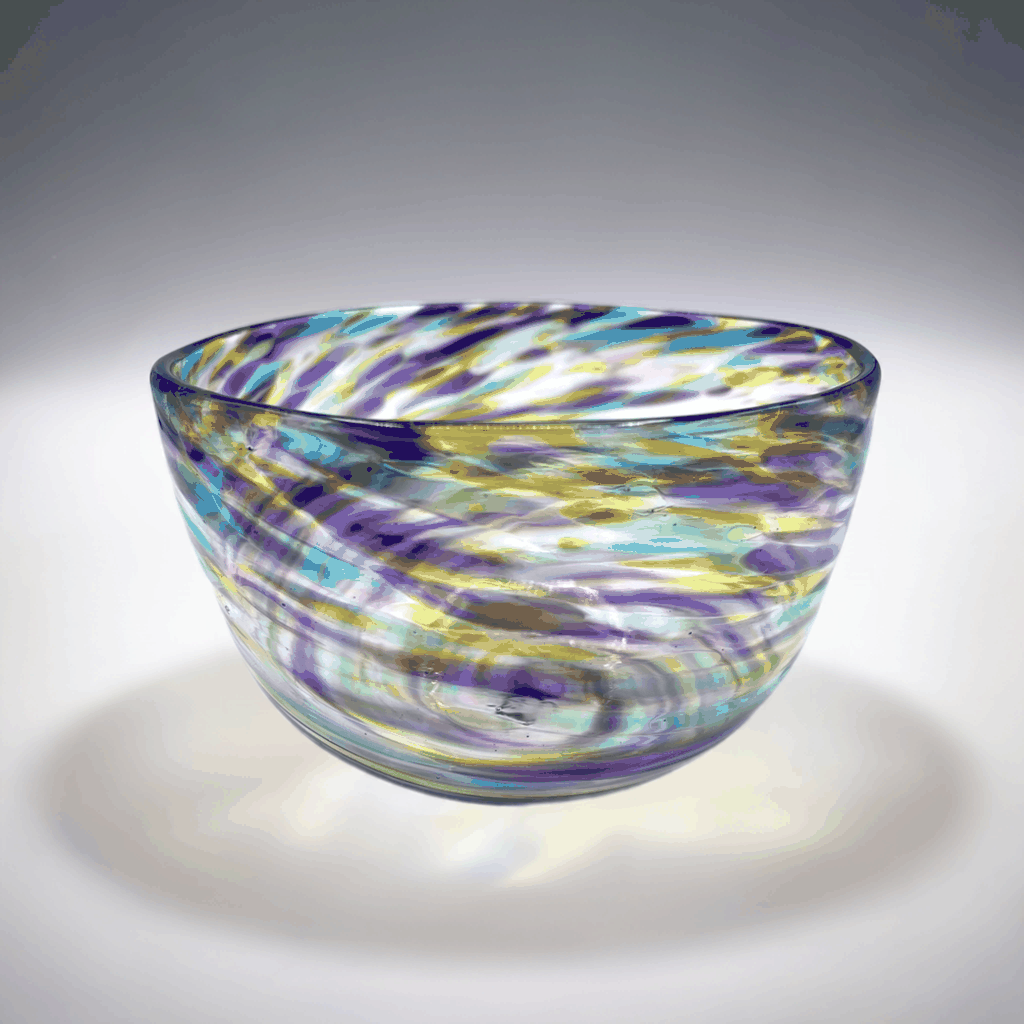 Hand-blown fruity blown glass bowl with vibrant sunset-inspired gradient colors in hyacinth, olive, and aqua hues.