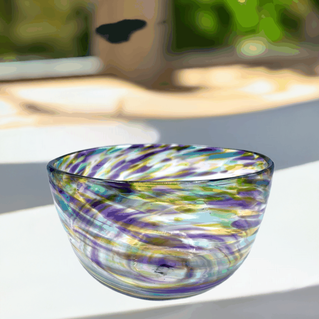 Hand-blown fruity blown glass bowl with swirling hyacinth, olive, and aqua colors and a twisted organic shape.
