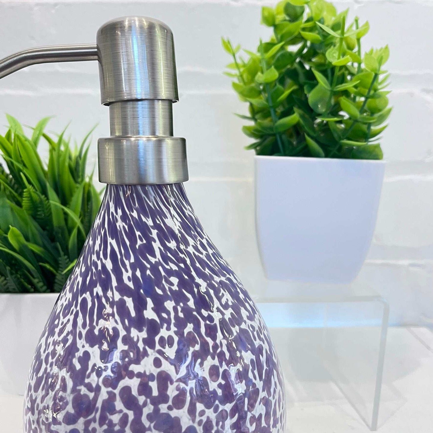 Hand blown hyacinth and white speckled glass soap dispenser with stainless steel pump and artisan riverstone design