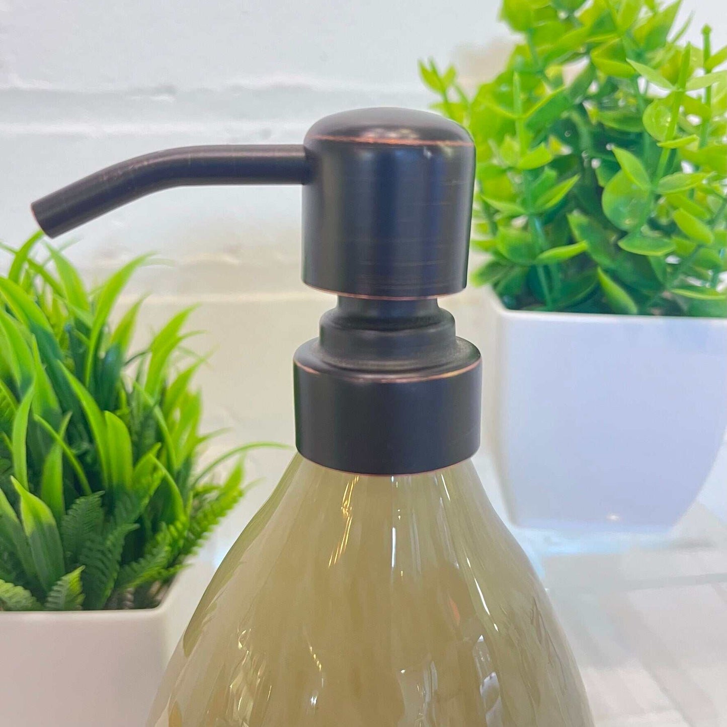 Bright and bold handblown glass soap dispenser with dark pump and 12 oz capacity for kitchen or bathroom.
