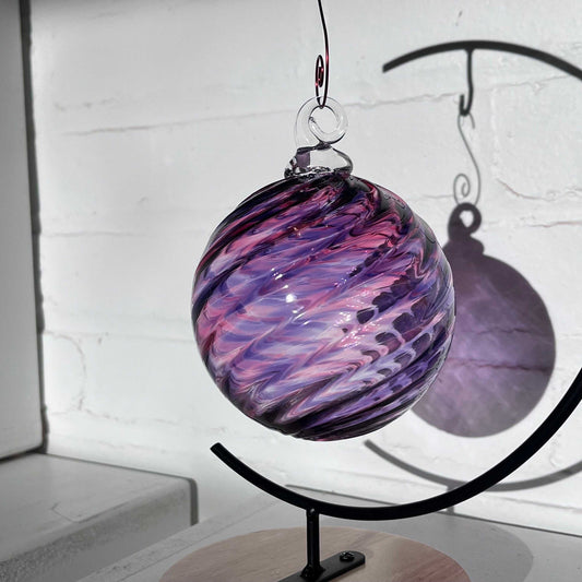 Purple Mix Spiral Twist hand blown glass ornament with spiral swirl design hanging on display stand