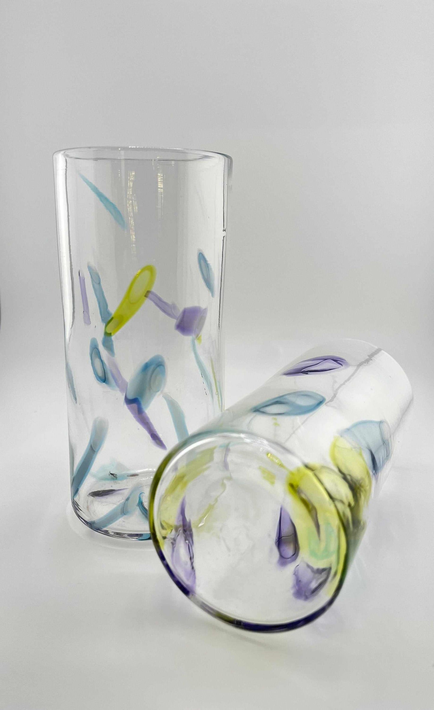 Super Sassy Set of Two High Ball Hand Blown Glasses with colorful murrini designs in citron, hyacinth, and bluestone, dishwasher safe.