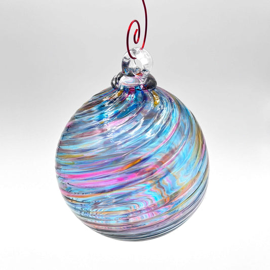 Hand blown glass holiday ornament with bluesy spiral twist design and vibrant colors, perfect for gifting and year-round decoration.