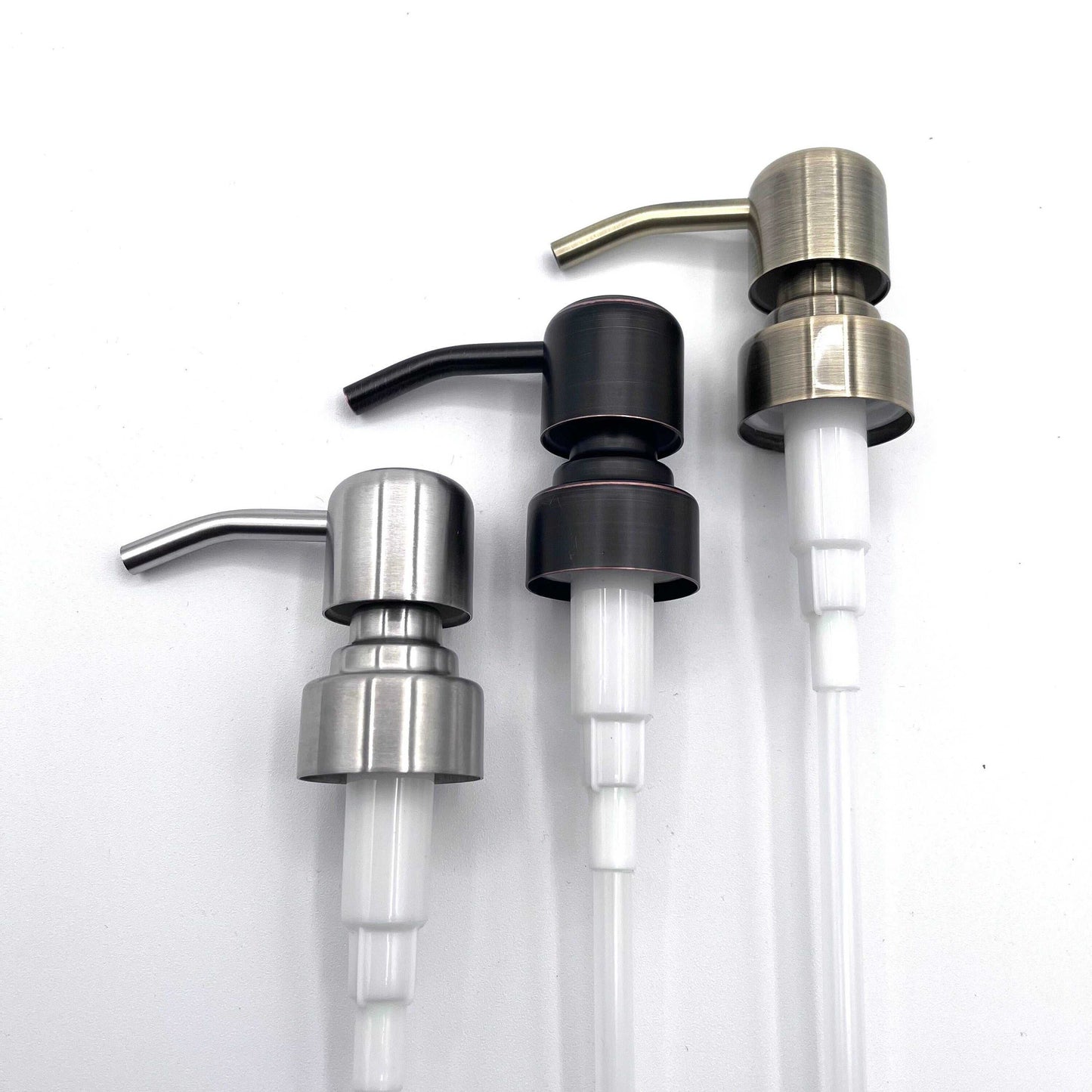 Three replacement soap pumps in nickel, brass, and bronze finishes for DIY soap dispensers with standard 28mm threads and 8-inch straws.