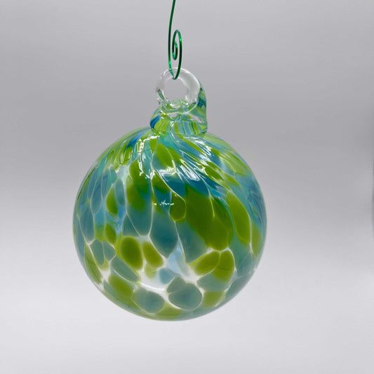 Green speckled hand blown glass ornament hanging with swirled blue and green patterns, 4x4 inches, perfect for gifting and year-round decoration