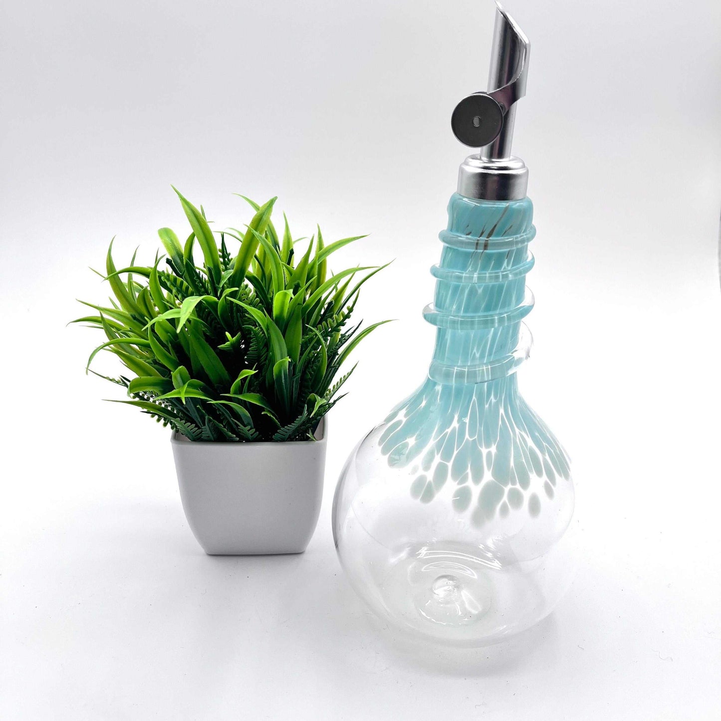 Celadon Oil & Vinegar spiral neck drizzler bottle with weighted pour spout and hand blown glass design