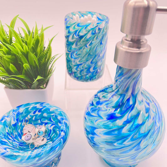 Marbled glass vanity set in ocean blues with hand-blown soap dispenser, bowl, and coordinating glass.