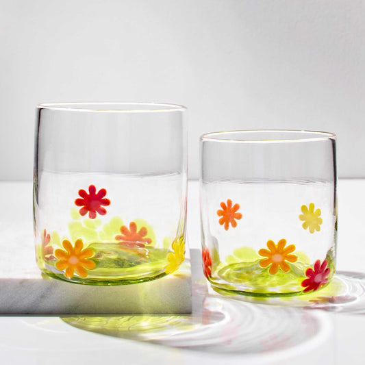 Set of hand blown whiskey glasses with colorful flower power design, made in Rhode Island.