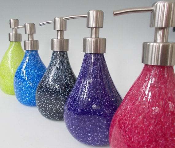 Granite soap pumps in various colors with hand blown art glass and brushed nickel tops