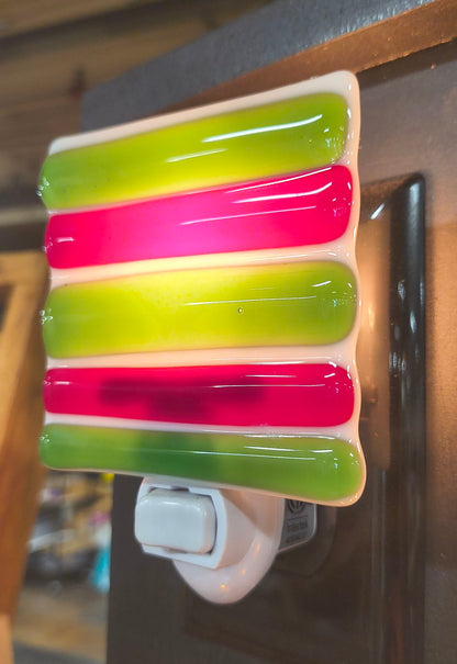 Colorful fused glass nightlight with green and pink stripes handcrafted in Choose Your Own Fusing Project class