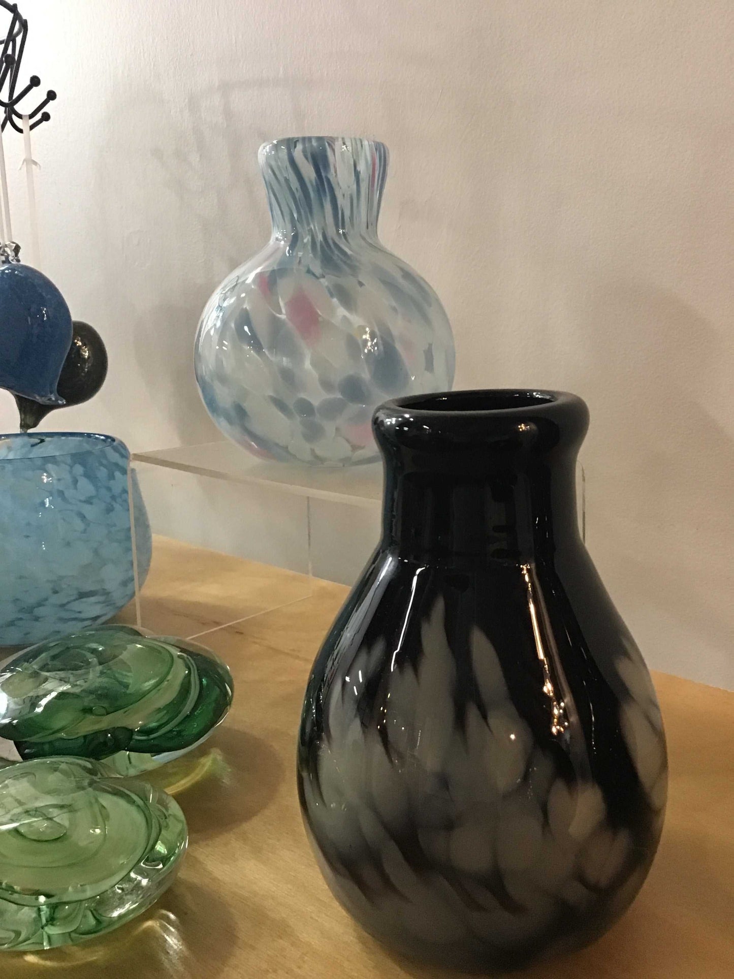 Medium vase with black and white marbled glass design displayed on wooden surface
