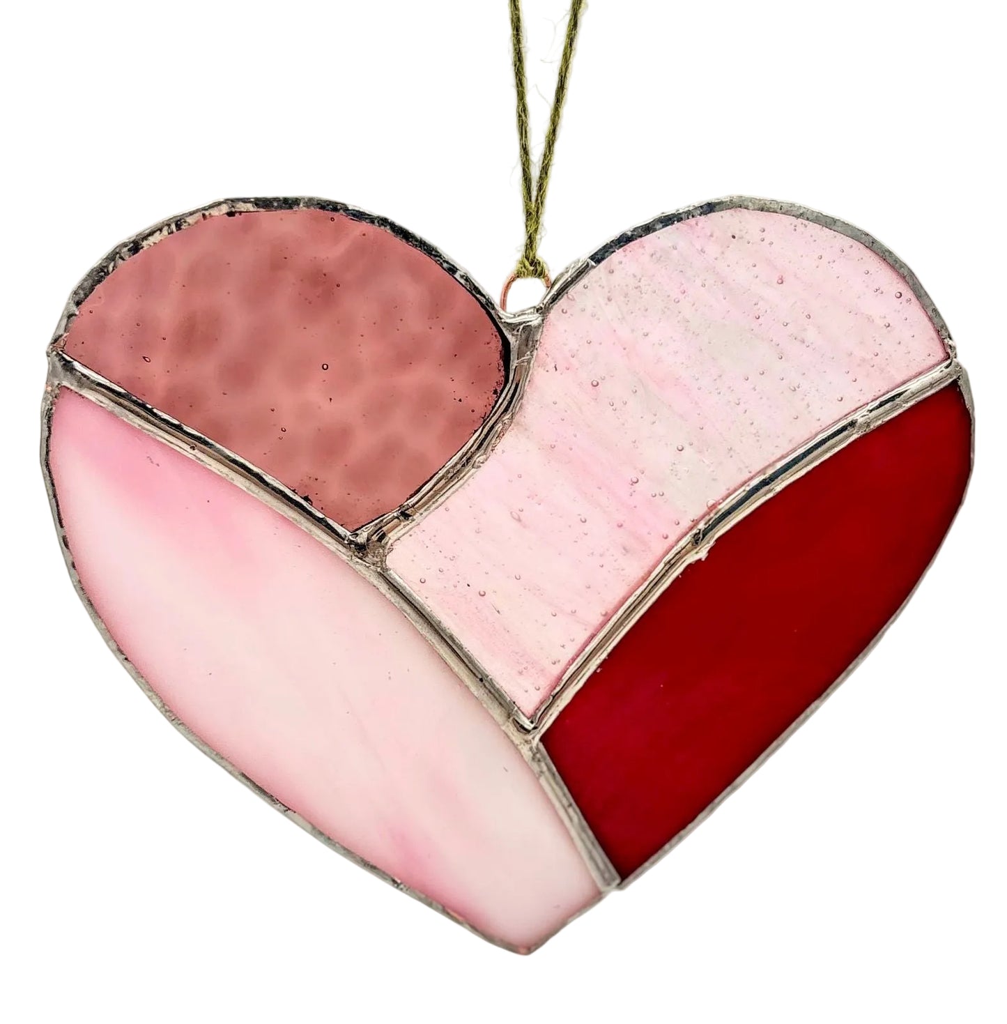 Heart-shaped stained glass ornament with pink, red, and white sections on a light gray background.