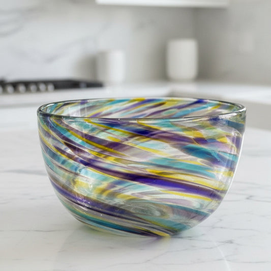 Hand-blown fruity blown glass bowl with vibrant swirling colors of hyacinth, olive, and aqua in a modern serving design