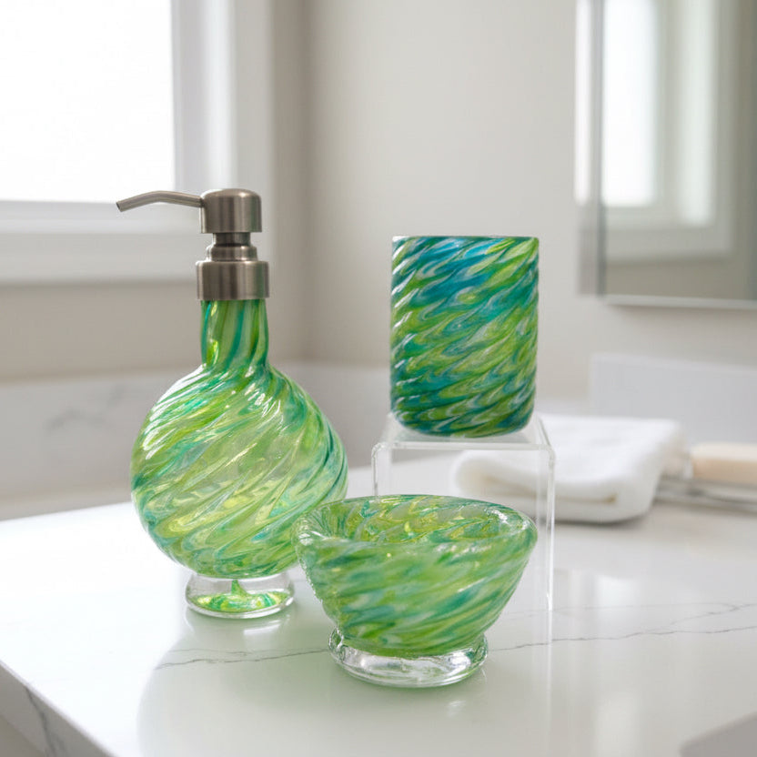 Marbled glass vanity set in emerald and olive green with soap dispenser, bowl, and glass, handmade with a swirling marbled design