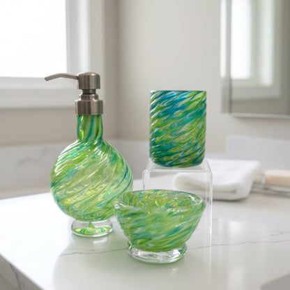 Marbled glass vanity set in emerald and olive green with soap dispenser, bowl, and glass, handmade with a swirling marbled design