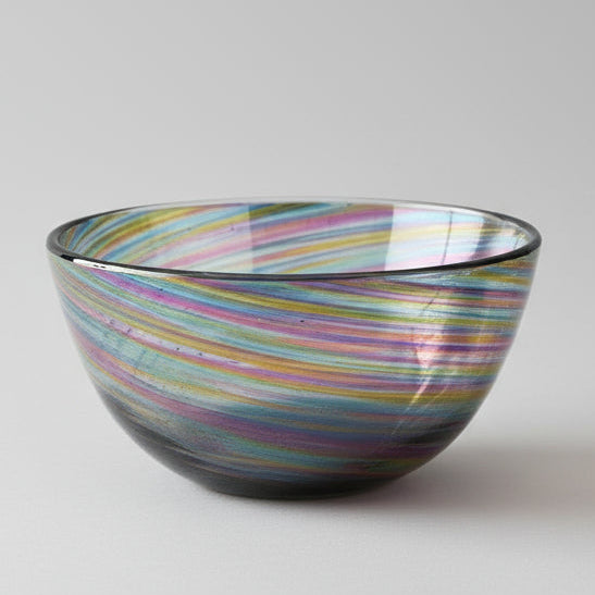 Hand-blown Rainbow Twist Serving Bowl with vibrant rainbow gradient colors and twisting design on wooden stand
