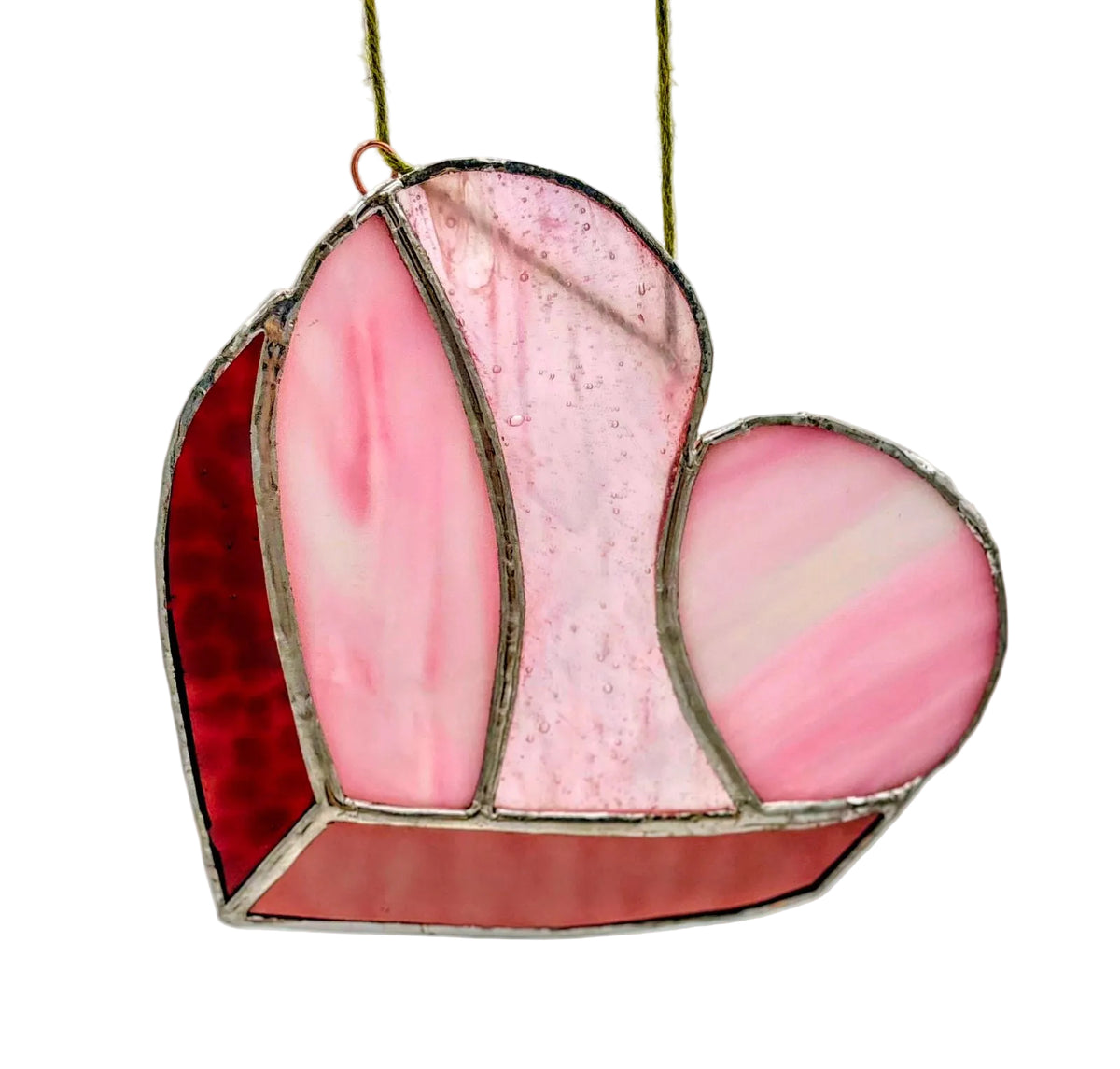 Heart-shaped stained glass panel with pink and red colors on a white background