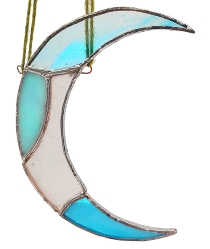 Stained glass moon-shaped ornament with blue and clear glass on a white background