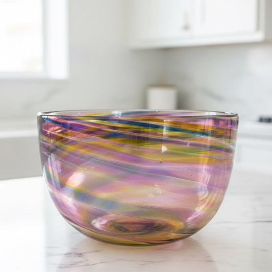 Hand-blown Sunset Twist Serving Bowl with vibrant orange, gold, and red sunset-inspired gradient and twisting organic shape