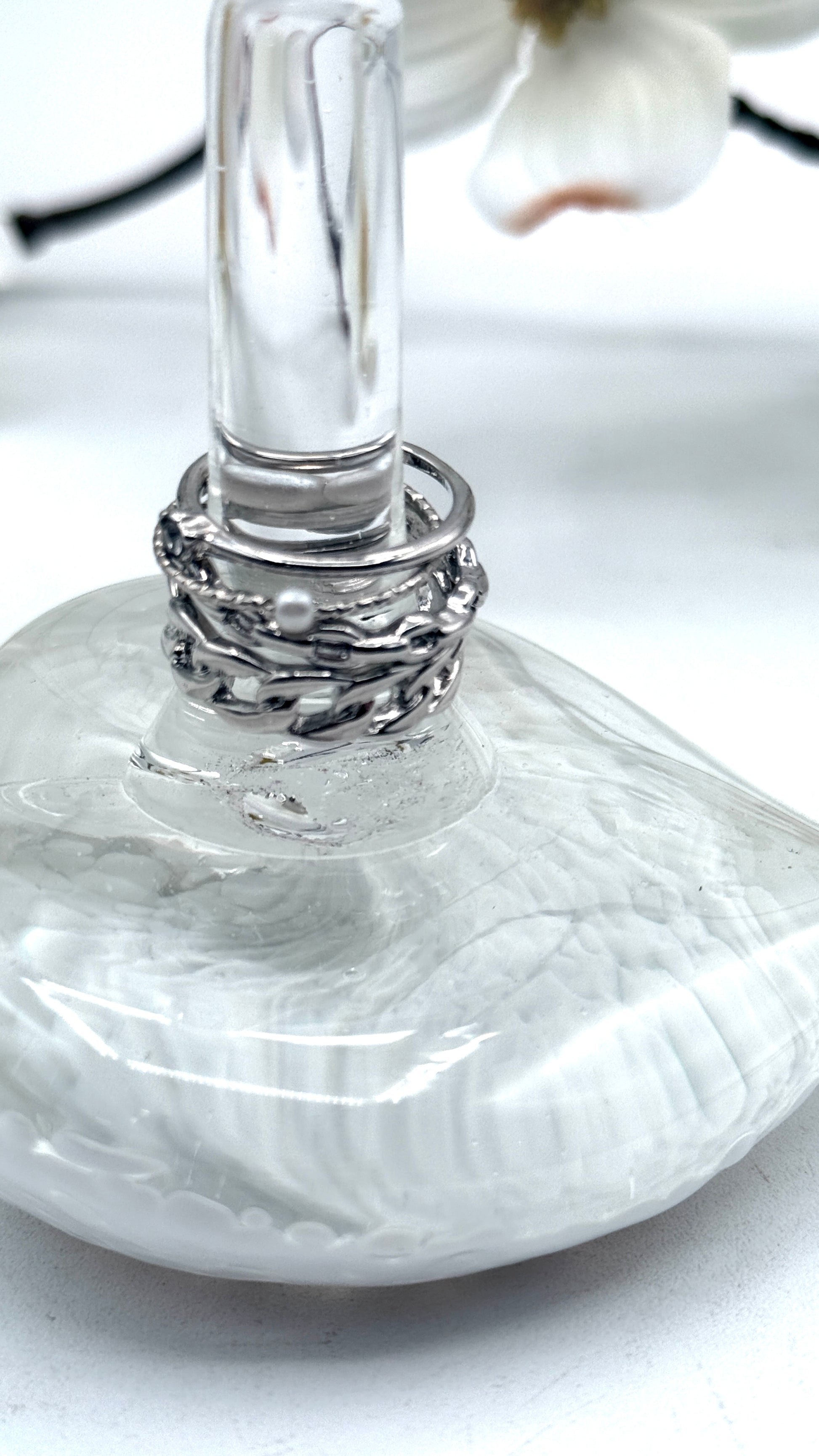 Close-up of a glass with a decorative base on a white surface