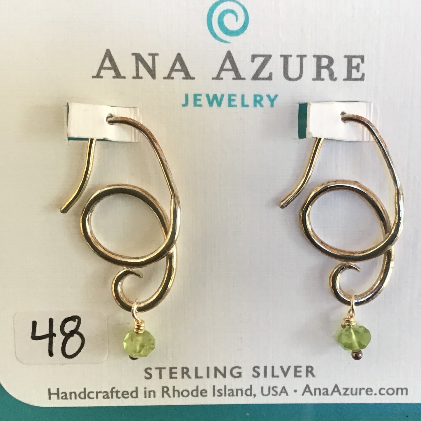 Silver twist earring with green bead