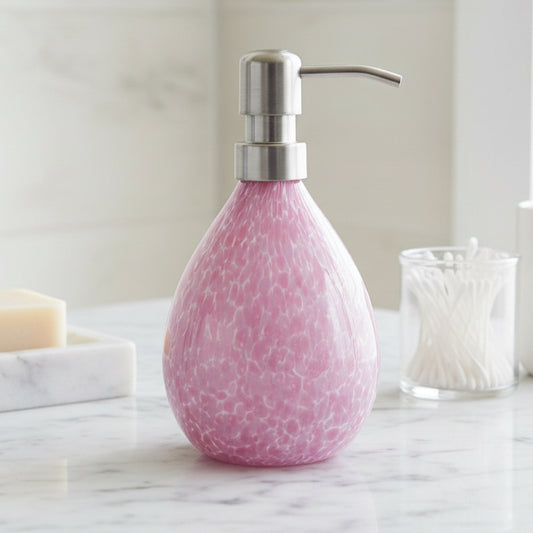 Pink hand blown glass soap dispenser with stainless steel pump and speckled design, 12-ounce capacity.