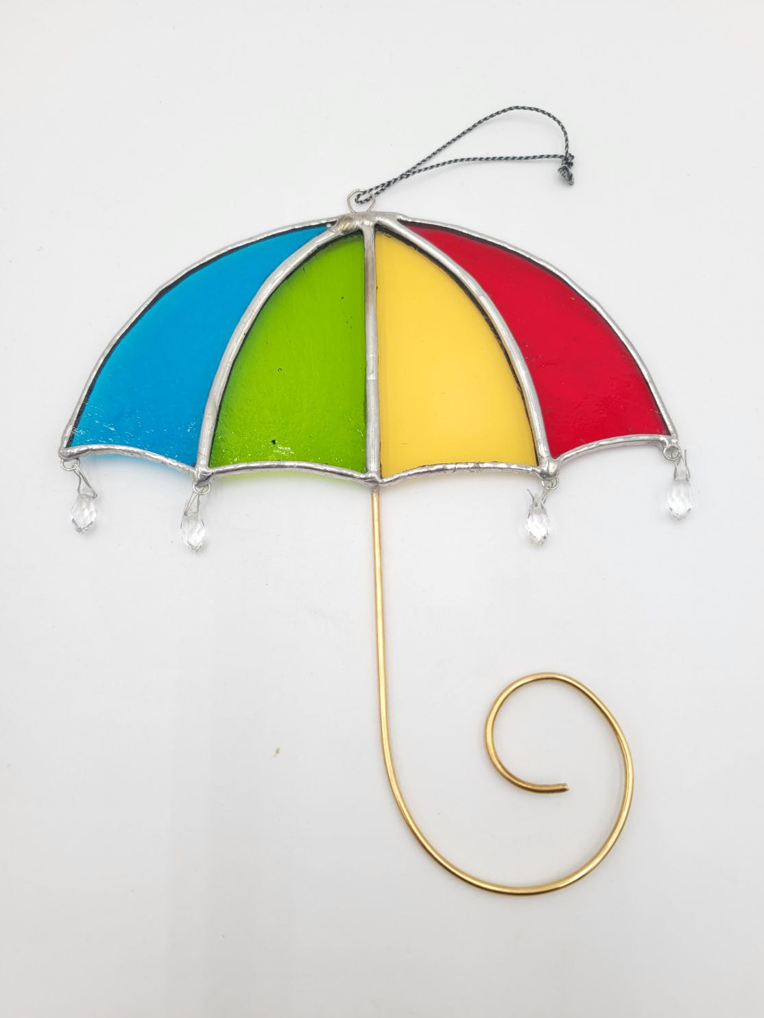 Colorful stained glass umbrella decoration on a white background