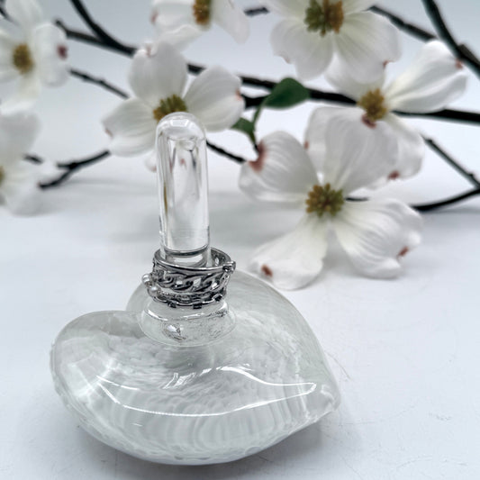 white heart with silver rings on stand